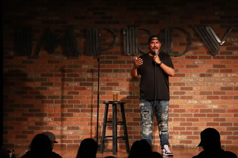 Chris on stage at the Improv