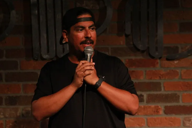 Chris performing at the Improv